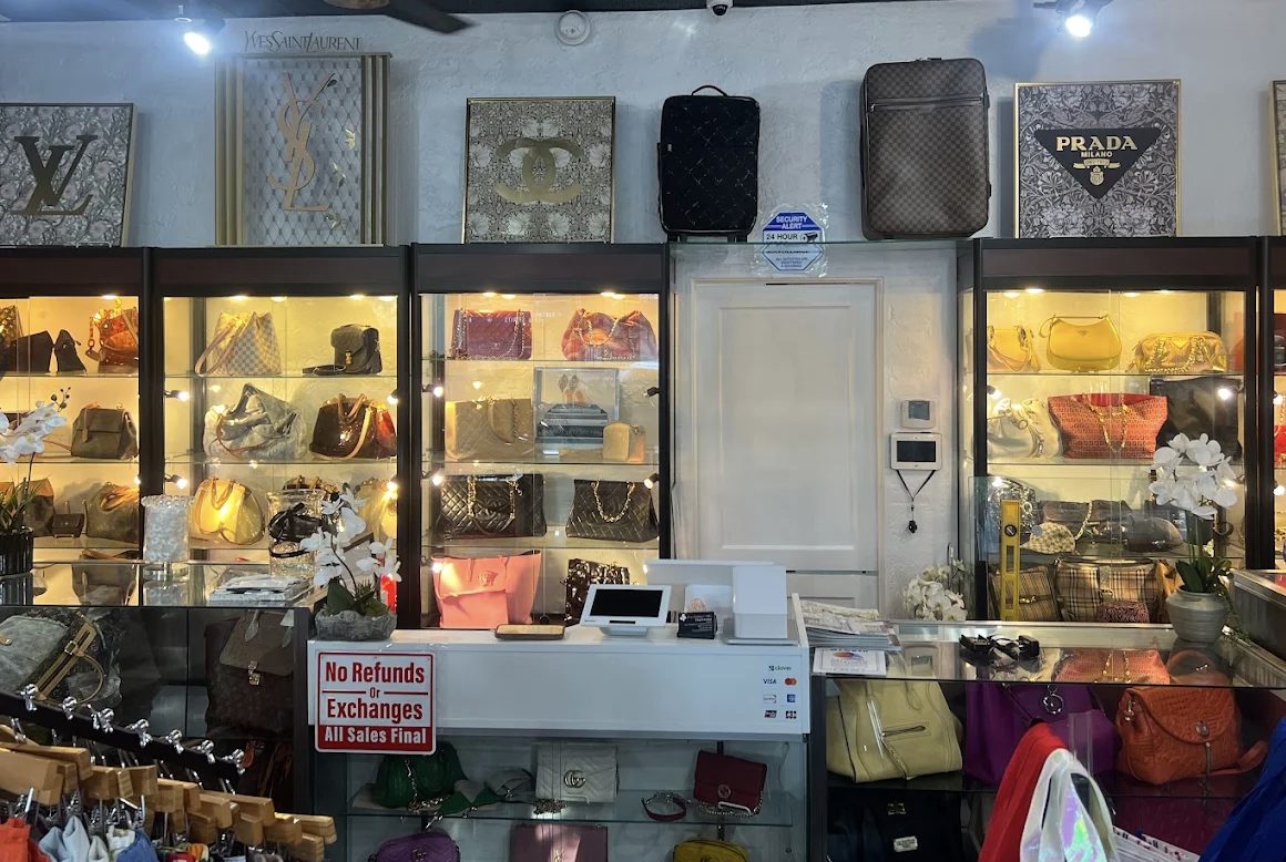 The designer handbag wall inside Love, Fashion & More